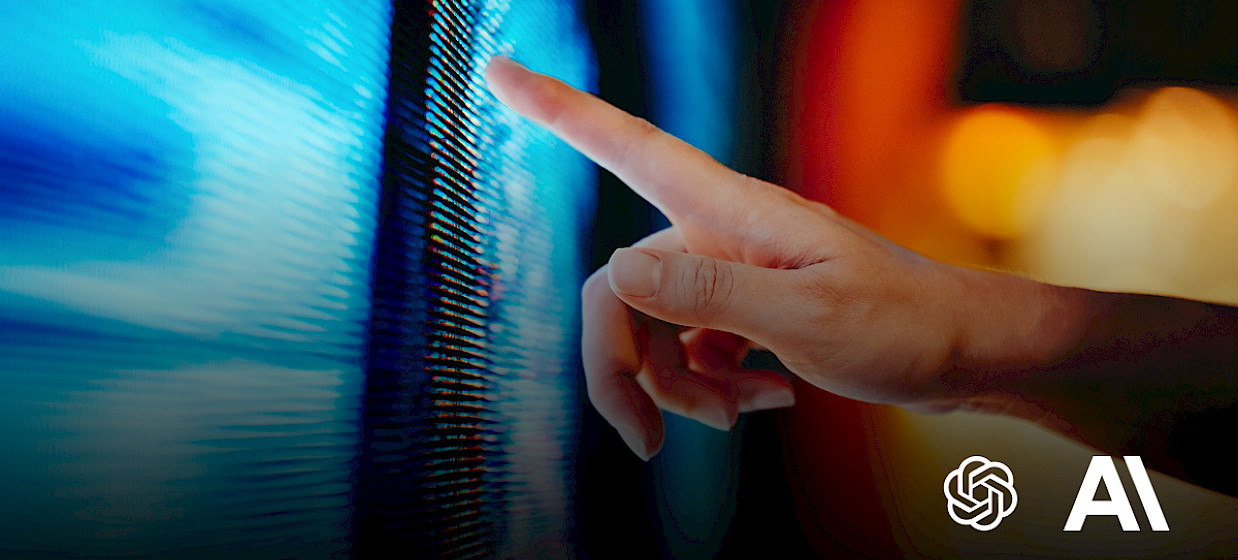 hand touching a glowing blue screen beside the OpenAI and Anthropic logo.